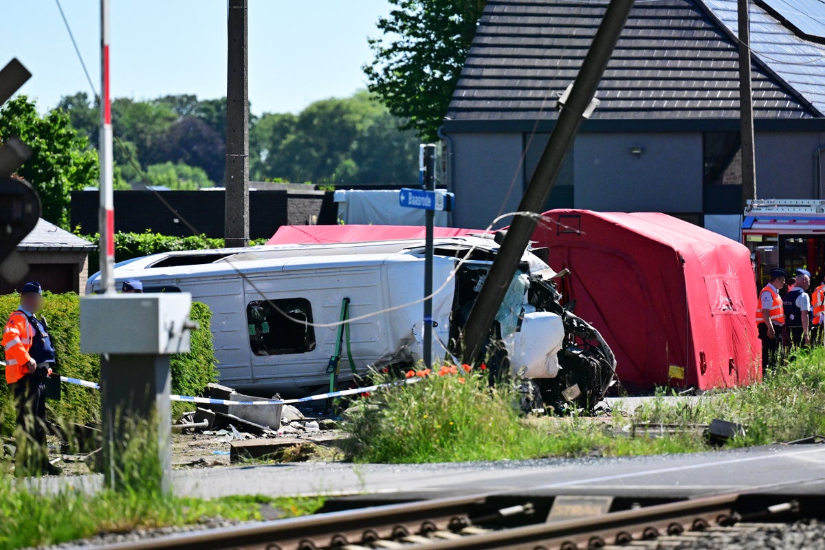 Two teenagers among four dead after train collides with school bus
