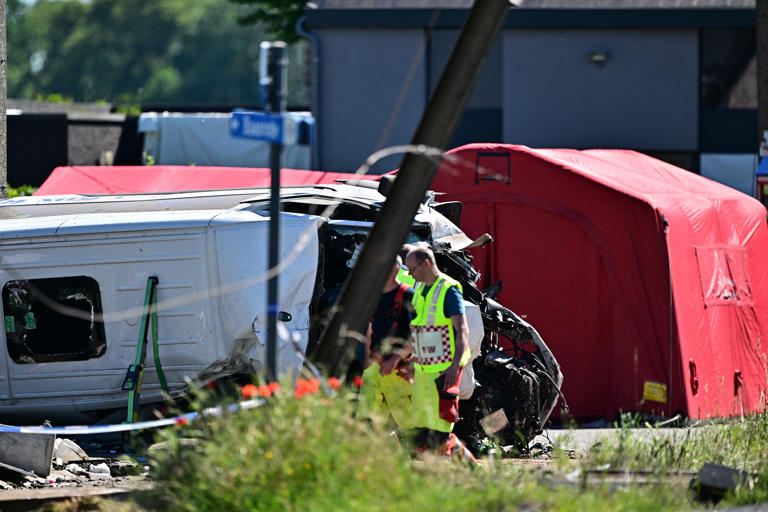 Two teenagers among four dead after train collides with school bus