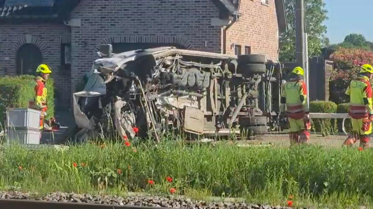 Two teenagers among four dead after train collides with school bus