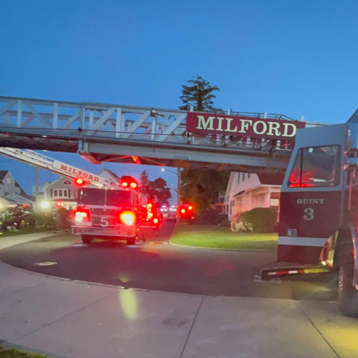 Man escapes after smoke detectors warn of heavy fire in Milford home