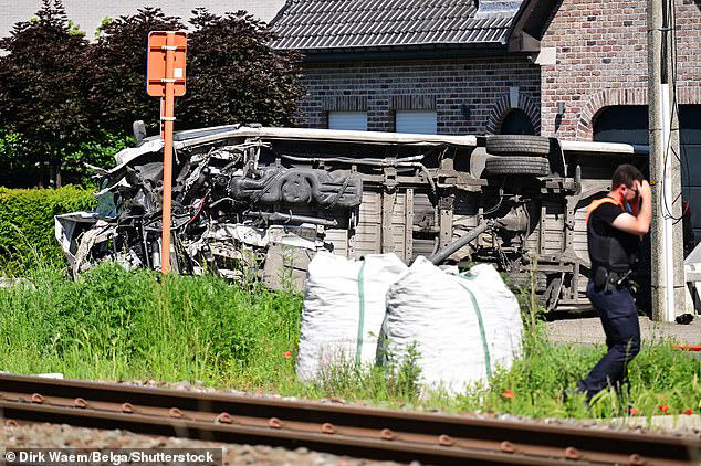 A train crashed into a school bus in Belgium on Tuesday, leaving several 'victims'