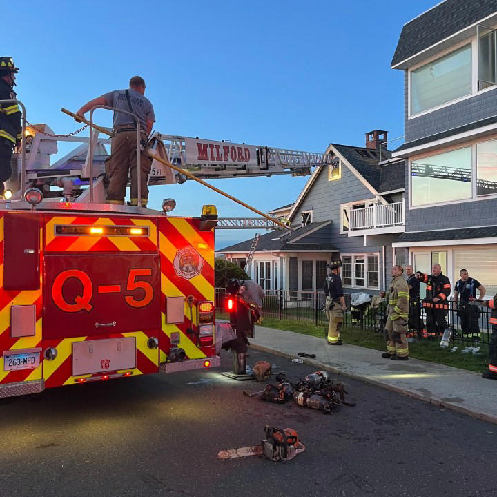 Man escapes after smoke detectors warn of heavy fire in Milford home