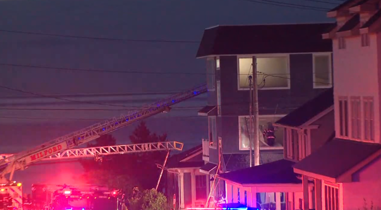 Man escapes after smoke detectors warn of heavy fire in Milford home