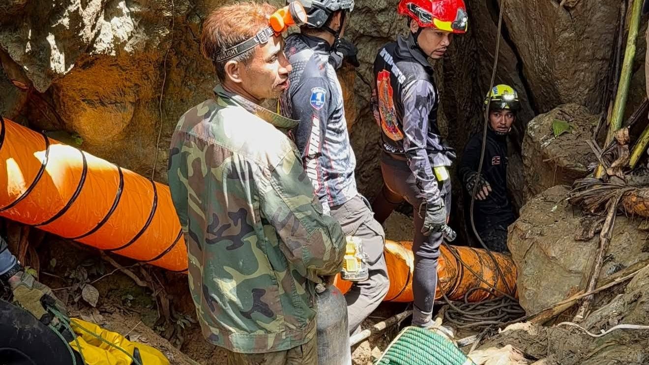Rescuers work to reach seven people who have been trapped in a cave in Xaisomboun province, Laos (Metta Tham Rescue Kalasin/AP)