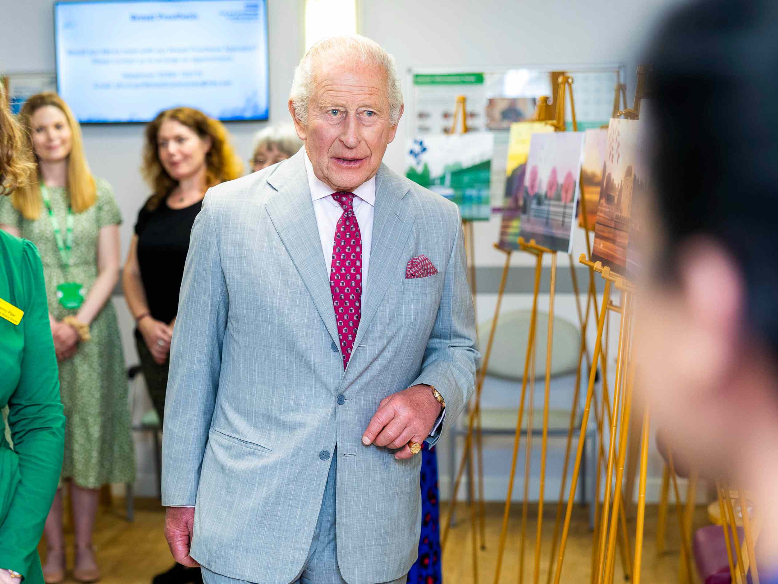 King Charles makes a rare etiquette-breaking move during a visit to a ...