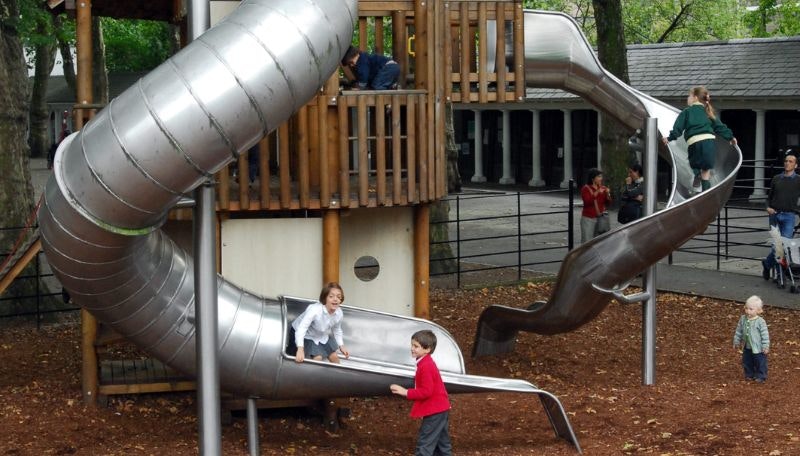 An adventure playground with a lagre metal slide