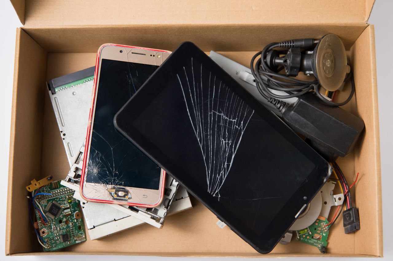 Box Full of Electronic Waste and Broken Devices