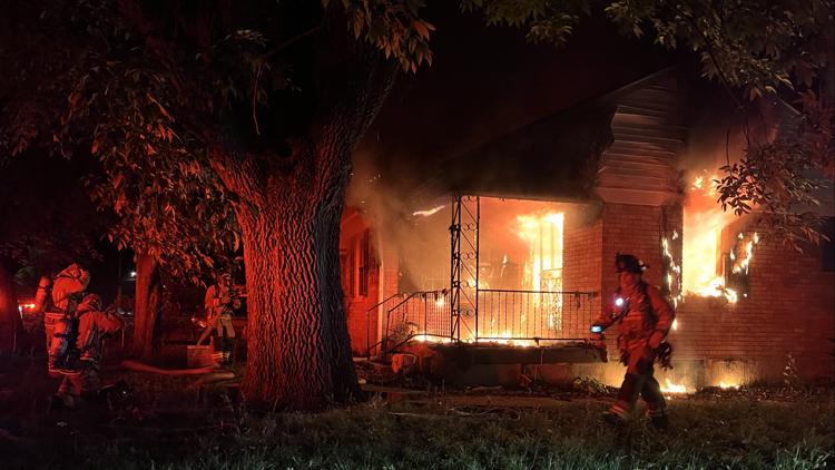 Fire crews battle early morning house fire in Louisville