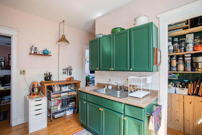 I put a rolling plant stand in my pantry, and it's the smartest storage ...