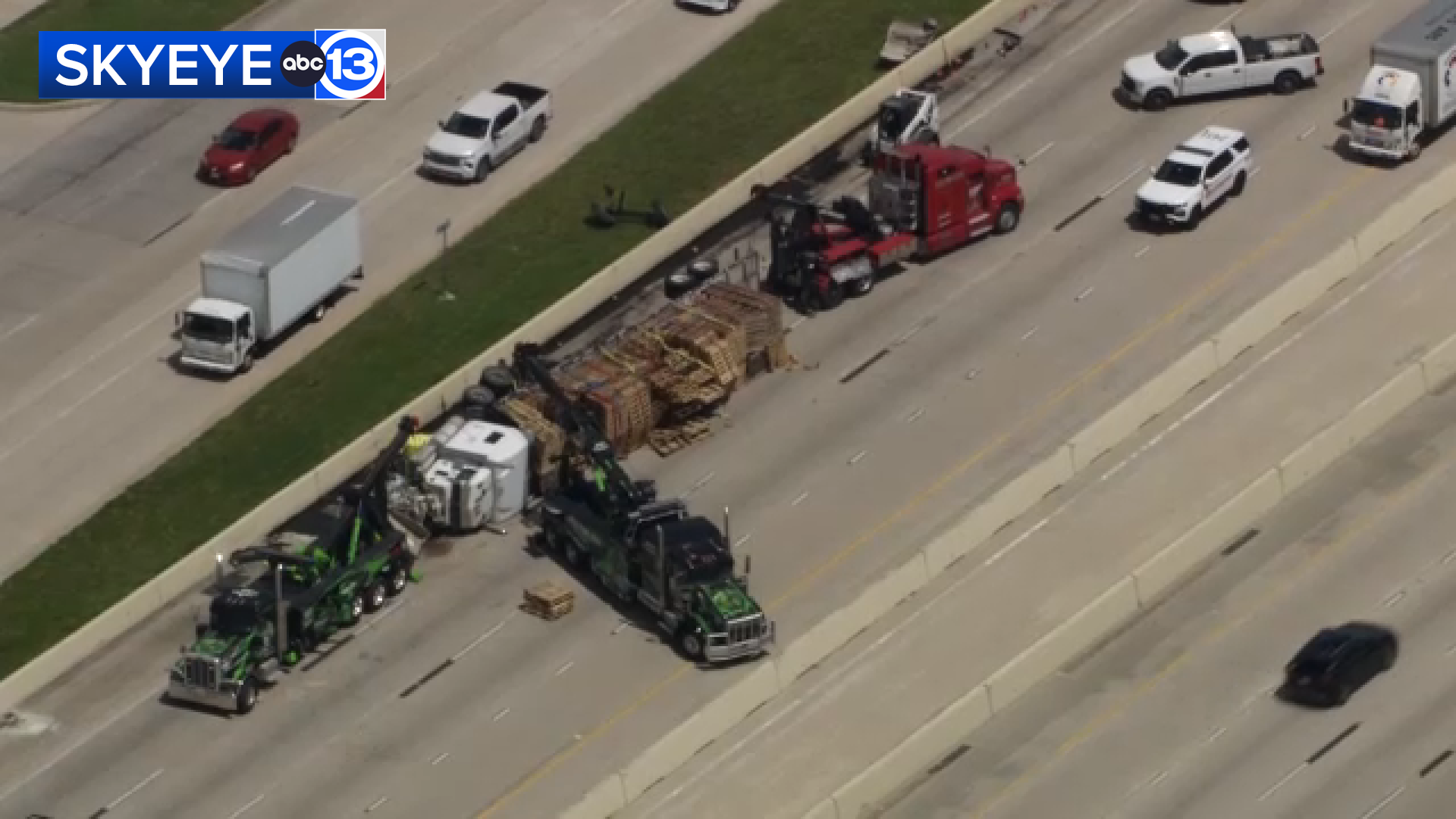 5 people hospitalized after overturned big rig shut down US-290 WB at ...