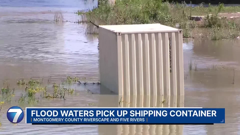 Shipping container picked up by flood waters