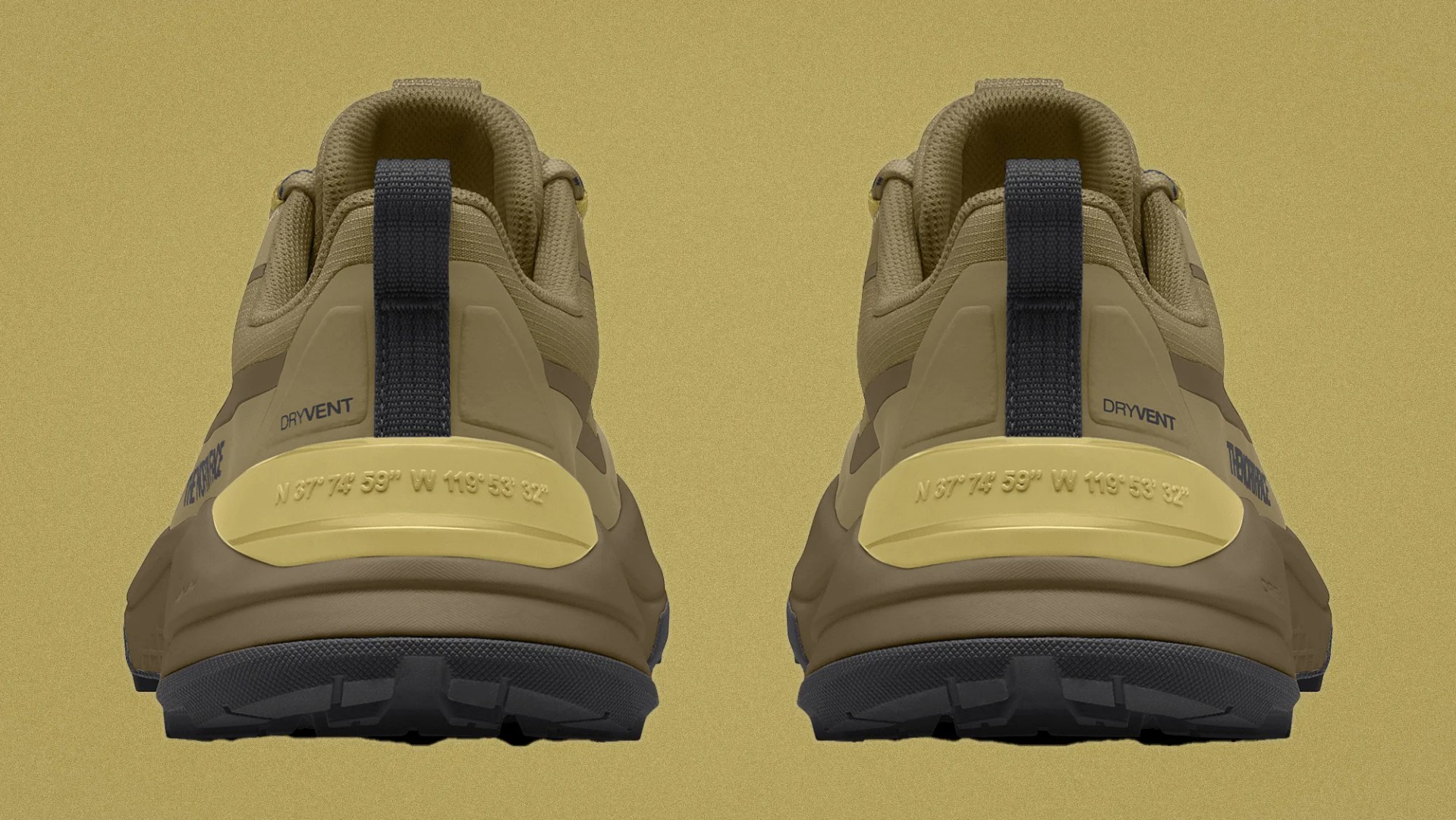 Pair of tan hiking shoes with black pull tabs and yellow heel accents showing coordinates on the back.