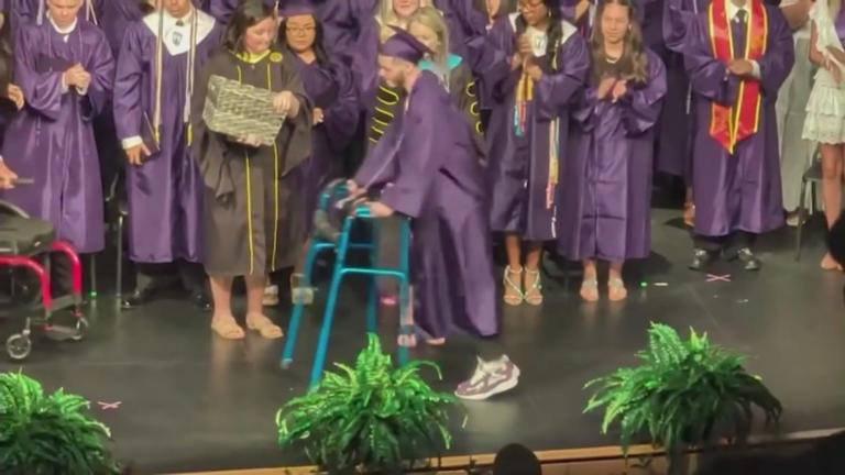 Paralyzed teen beats the odds, walks at graduation