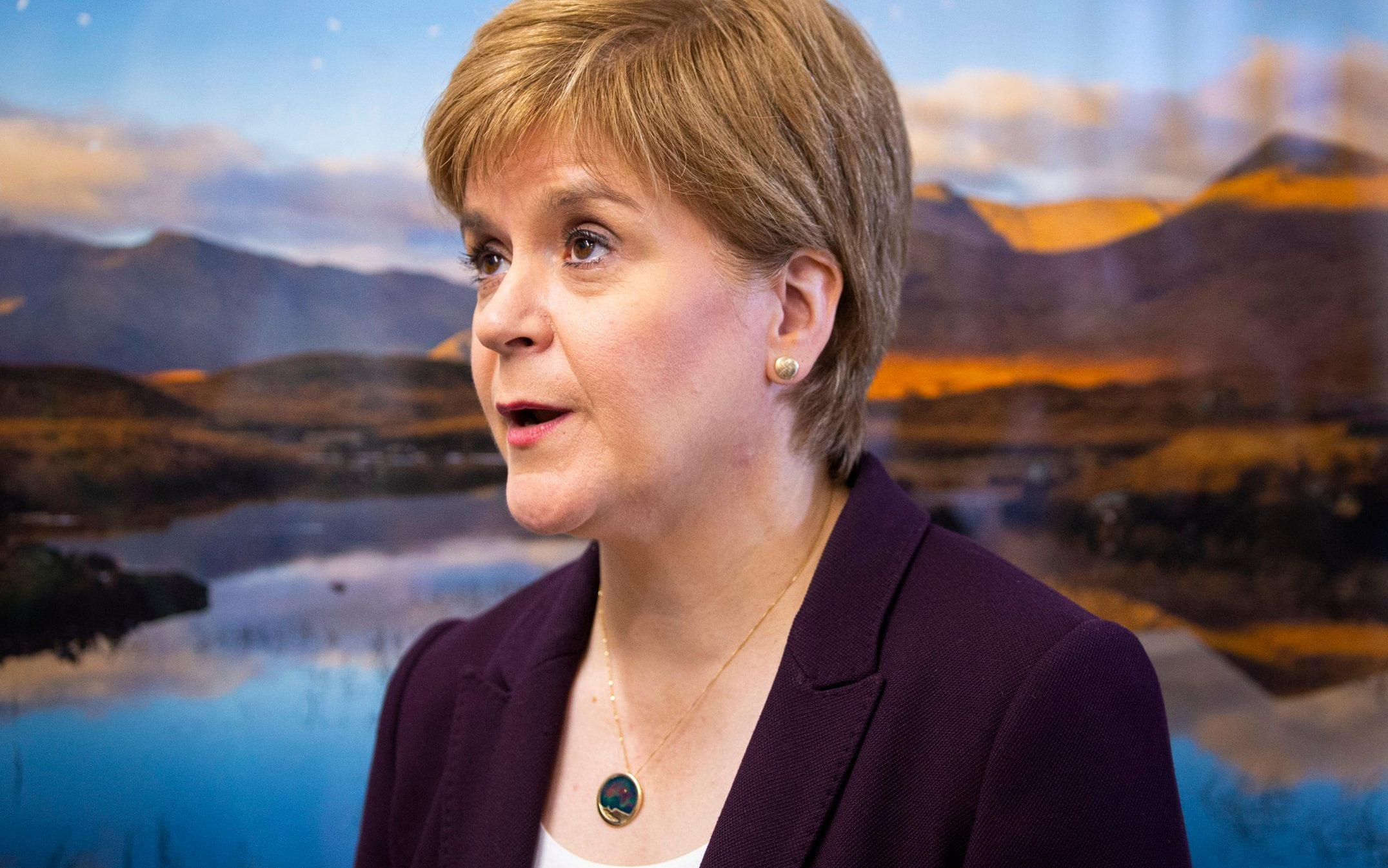Nicola Sturgeon wearing the gold pendant that was bought with embezzled money - Getty Images