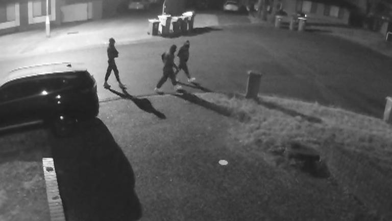Three men were captured on CCTV scoping out the street before the shooting and firebombing.