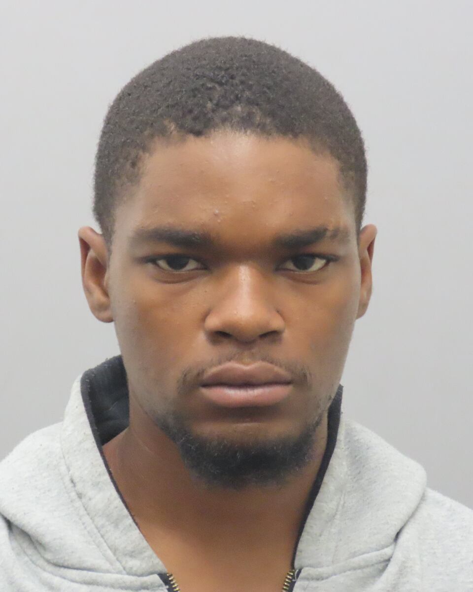 Man charged, accused of firing shots at people, injuring woman in the head
