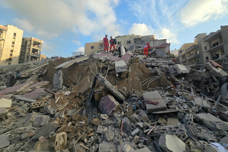 First responders gather at the site of an Israeli strike that hit near a hospital in the southern Lebanese city of Tyre on 1 June (AFP/Getty)
