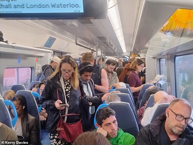 Passengers packed onto a South Western Railway train towards London Waterloo this morning