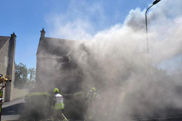 Firefighters respond to house fire blaze in dramatic pictures