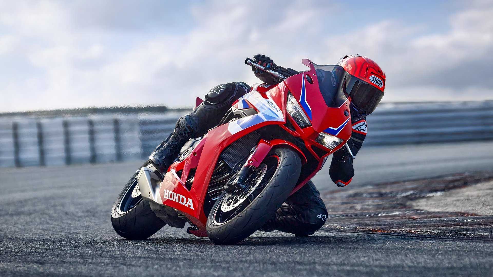 A rider cornering aboard the 2026 Honda CBR650R