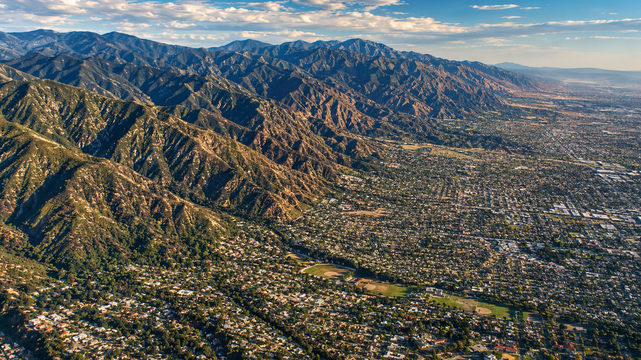Los Angeles spreading beneath the mountain ranges