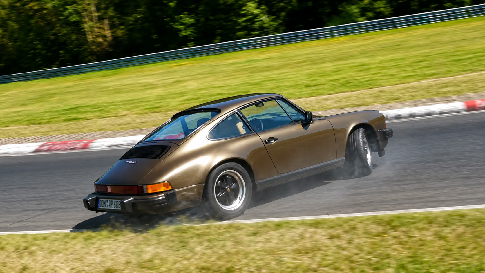 Classic Porsche spins out mid-corner creating a close call
