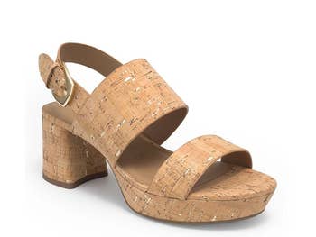 Chunky heel sandal with a cork-textured finish and ankle strap, perfect for casual and stylish outings