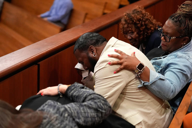 Erik Verduzco/AP Photo - PHOTO: Troy Belton, center, father of Cyrus Carmack-Belton, reacts after a not guilty verdict against Chikei Rick Chow, accused in the 2023 fatal shooting of his 14-year-old son, during a murder trial, on June 1, 2026, in Columbia, S.C.