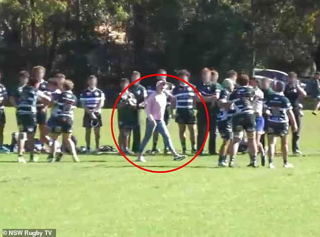 Pictured: The moment the mother of an Eastwood under-20s rugby player ran onto the field to protect him during a fight in a match on Saturday