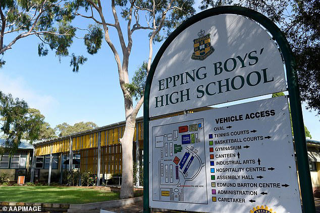 According to an eyewitness, the mum 'took her seat and refused to leave the sideline' after running on during the match at Epping Boys' High School (pictured)