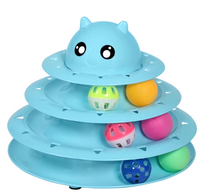 Cat toy with different levels containing colorful balls for interactive play