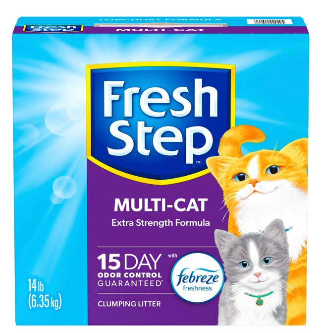 Fresh Step Multi-Cat litter box with images of a yellow and a gray cat, promoting 15-day odor control and Febreze freshness