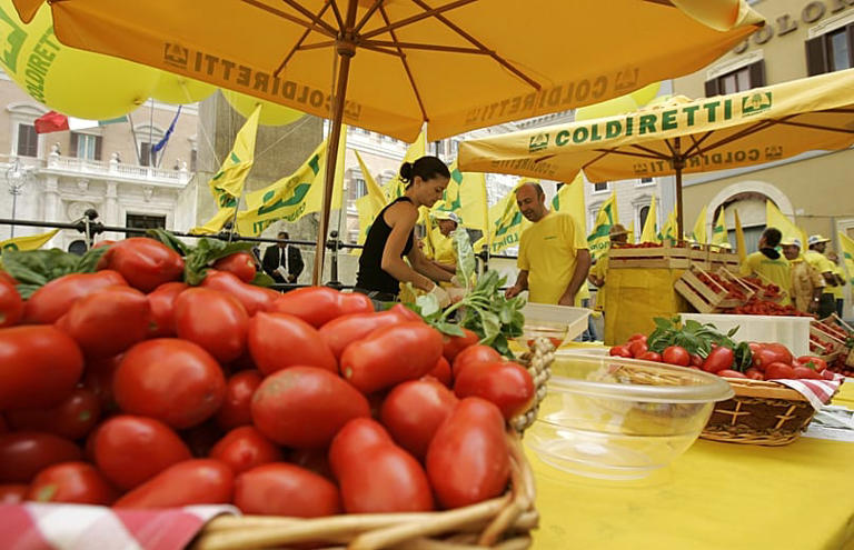 An Italian woman makes a tomato sauce in downtown Rome, 10 July, 2007 AP Photo