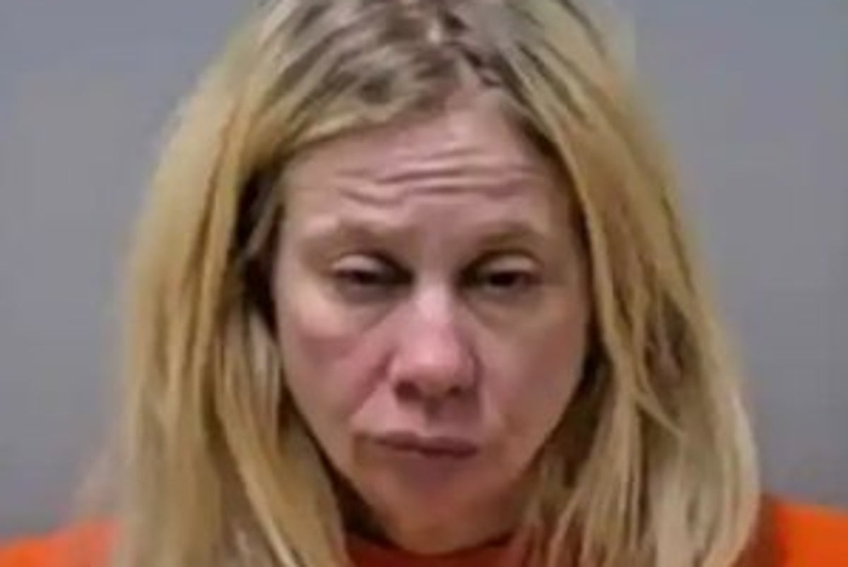 Driver charged in crash that killed an 82-year-old says it was her dog