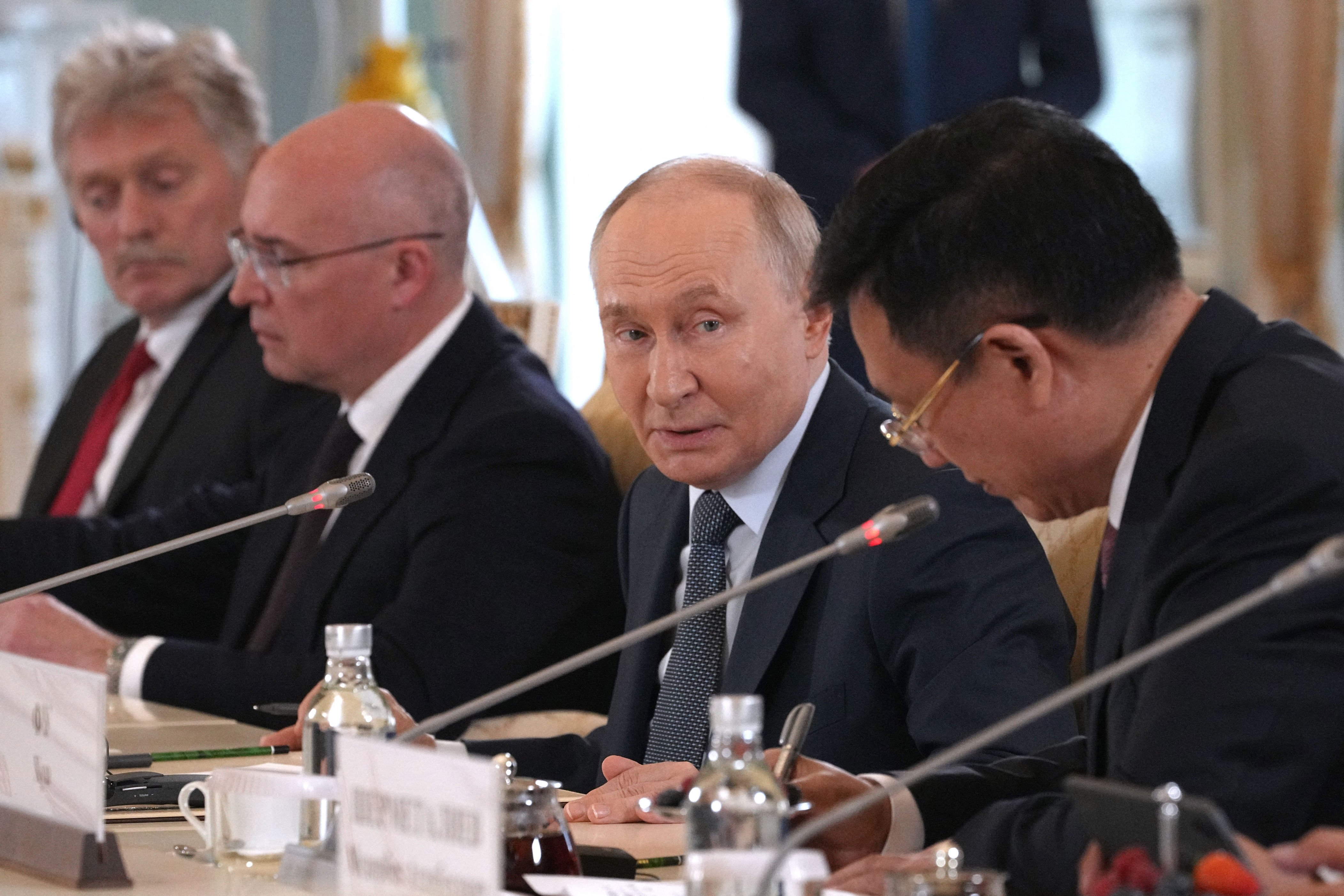 Russian president Vladimir Putin speaks to president of Xinhua News Agency Fu Hua during a meeting on the sidelines of the St. Petersburg International Economic Forum at the Constantine Palace in Saint Petersburg (AFP/Getty)