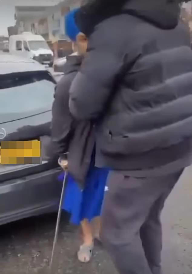 Gurpreet Digwa appeared to be held back while arguing with a fellow motorist on the road