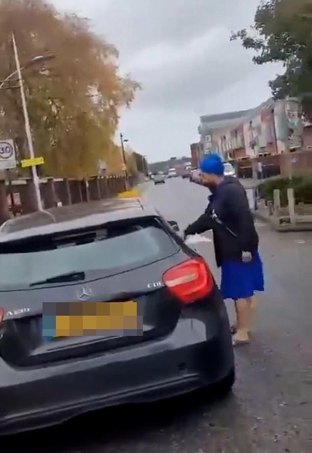 People were heard shouting 'you've got a problem' and Digwa eventually got back in the car