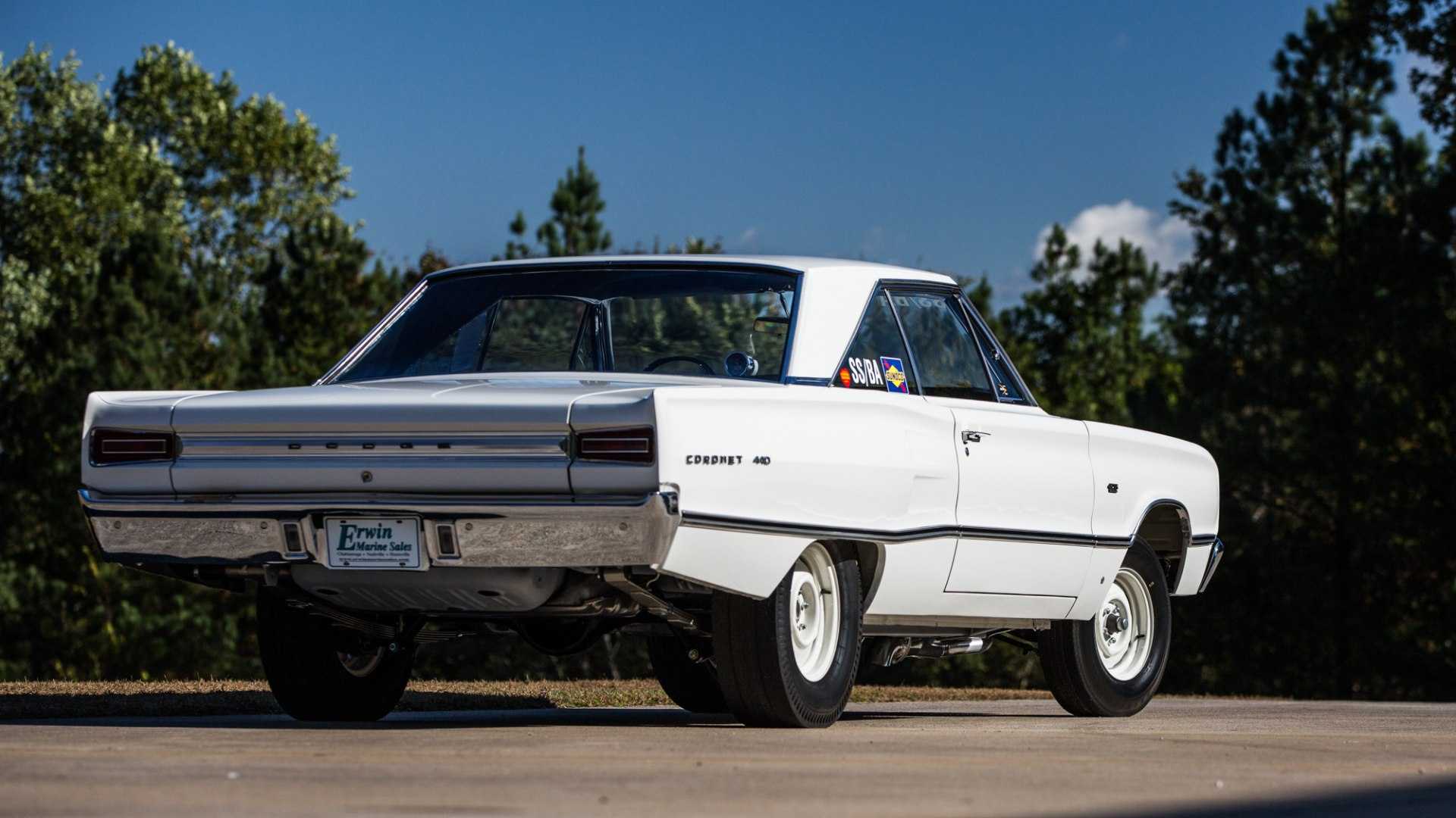 Rear of a white super stock Dodge muscle car