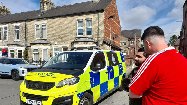 Exploding campervan damages buildings and cars