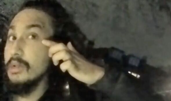 Digwa points to his eye in police body cam footage
