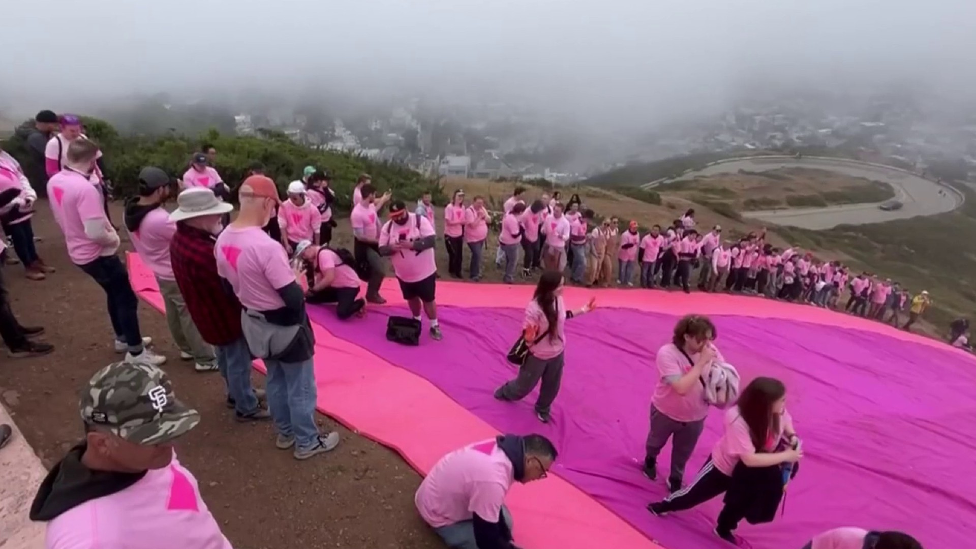 Volunteers begin setting up San Francisco's Pink Triangle for Pride Month