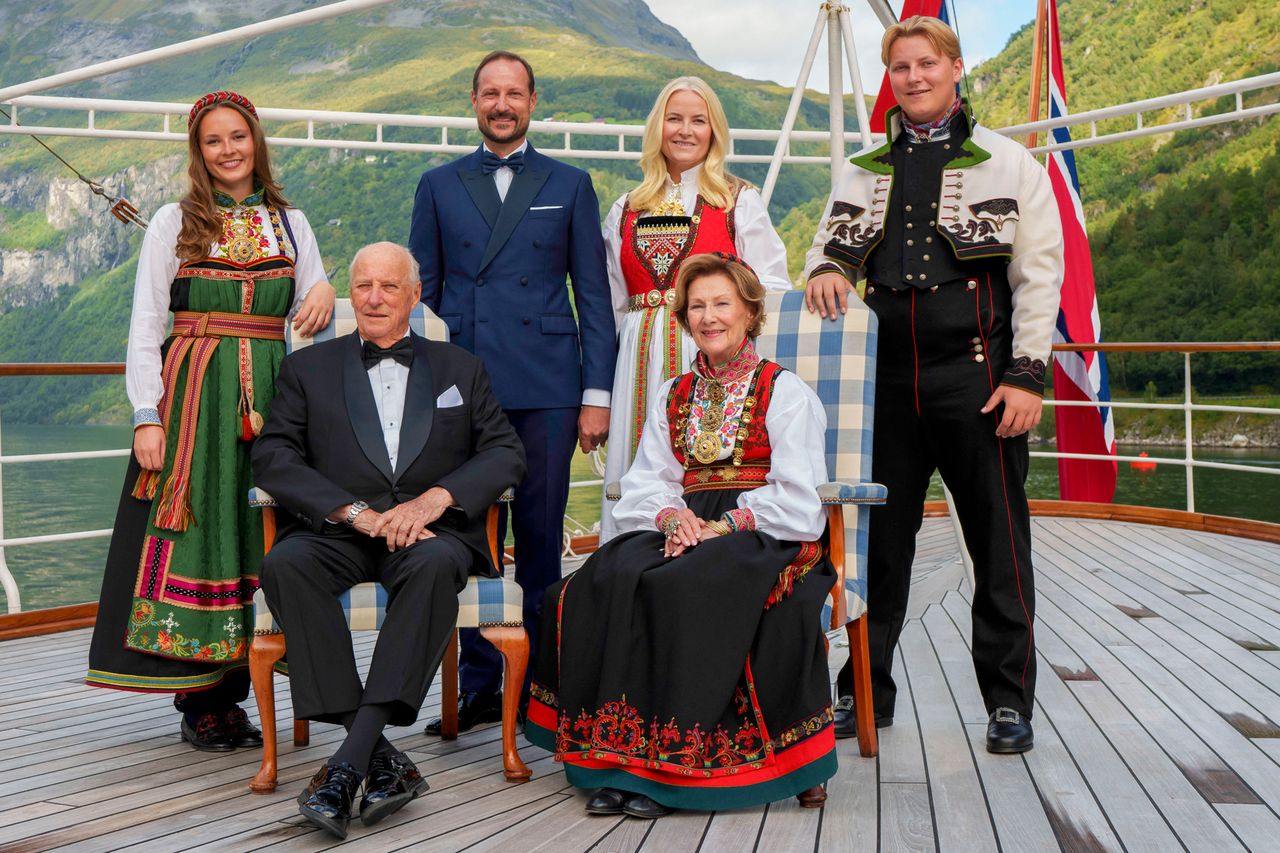 Norway's King Harald, Queen Sonja, Crown Prince Haakon, Crown Princess Mette-Marit, Princess Ingrid Alexandra, Prince Sverre Magnus pose for a group photo aboard the kingship Norway in the Geirangerfjord on August 31, 2024, where they attend Princess Martha Louise of Norway and her future husband Durek Verrett's wedding.