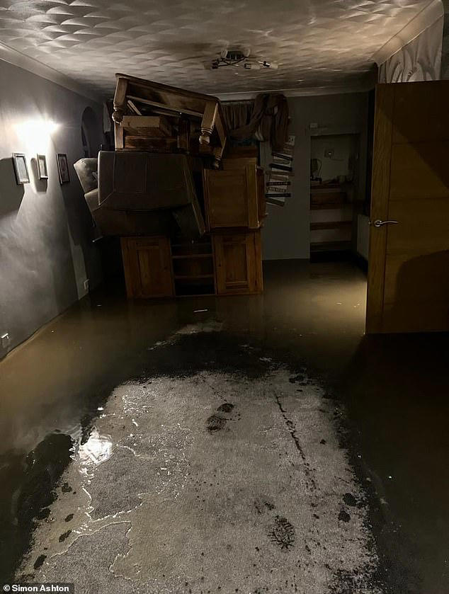 Family who built huge 'flood survival shed' are ordered to tear it down
