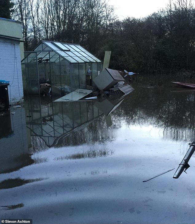 Family who built huge 'flood survival shed' are ordered to tear it down