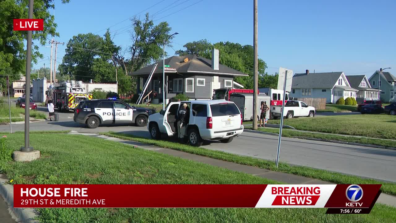 Multiple fire crews battle house fire in north Omaha