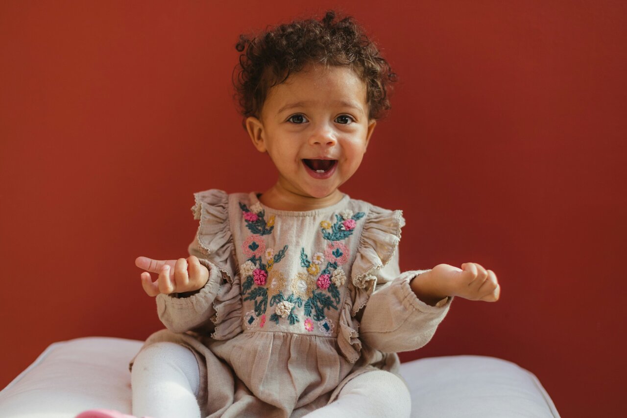 Childlike AI uncovers why language grows more structured across generations