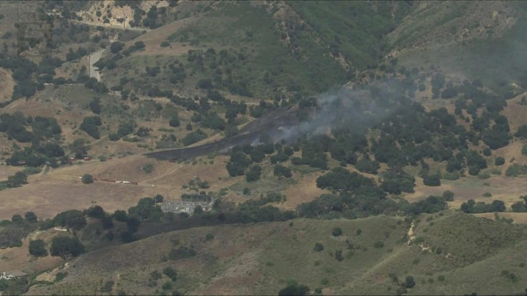 Crews work to contain brush fire near Malibu Canyon Road in Calabasas