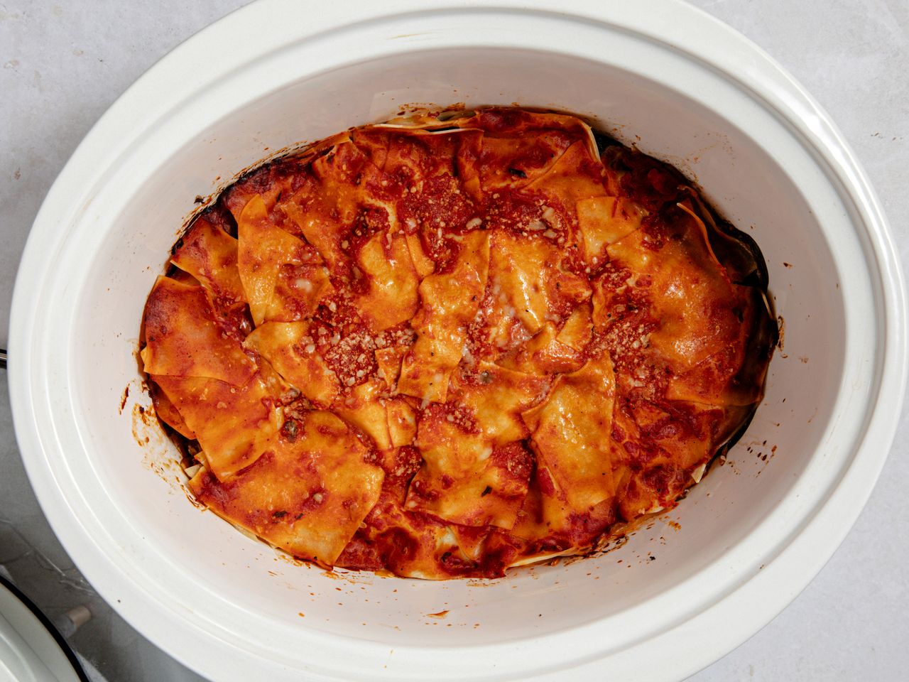 Overhead shot of lasagna cooked in a slow cooker
