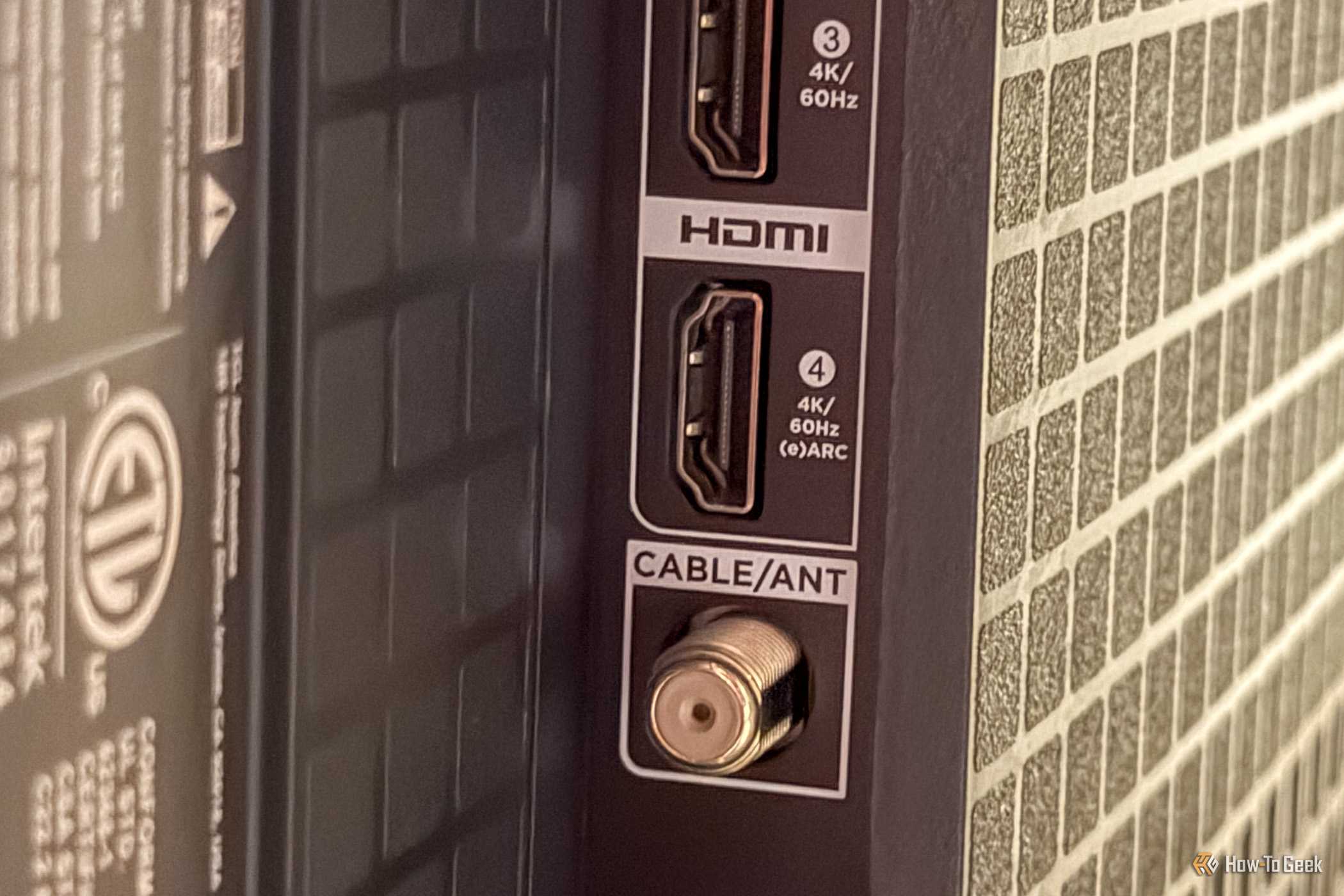 The HDMI eARC and coax cable jack on a TV.