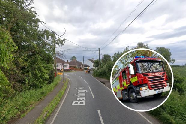 Two people trapped after car flips onto its roof rescued by fire crews